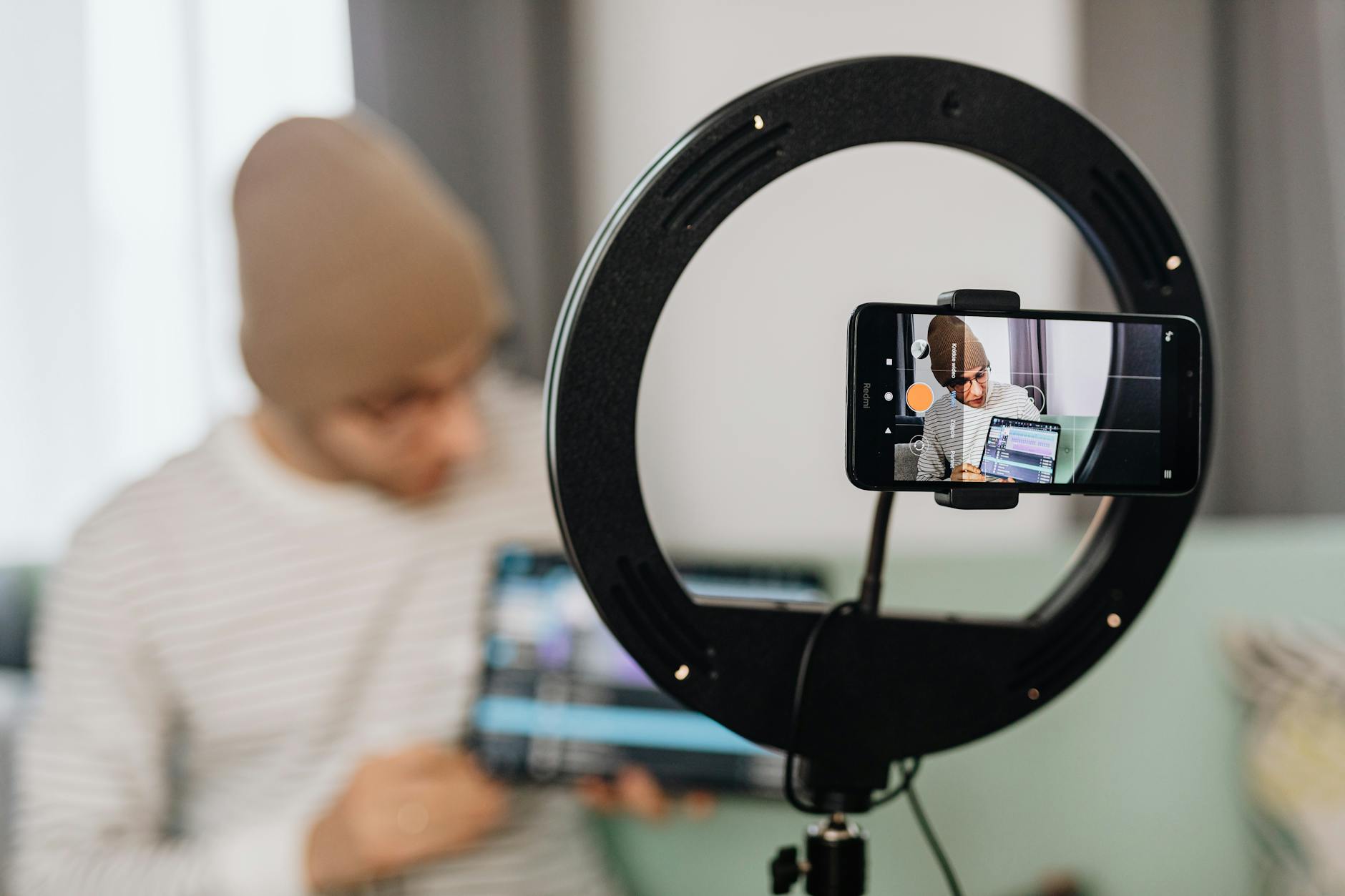 Travel content creator filming video with smartphone while exploring destination