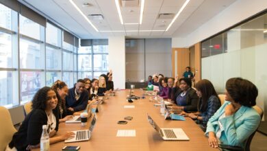 Professional meeting in modern office space with executives discussing strategy
