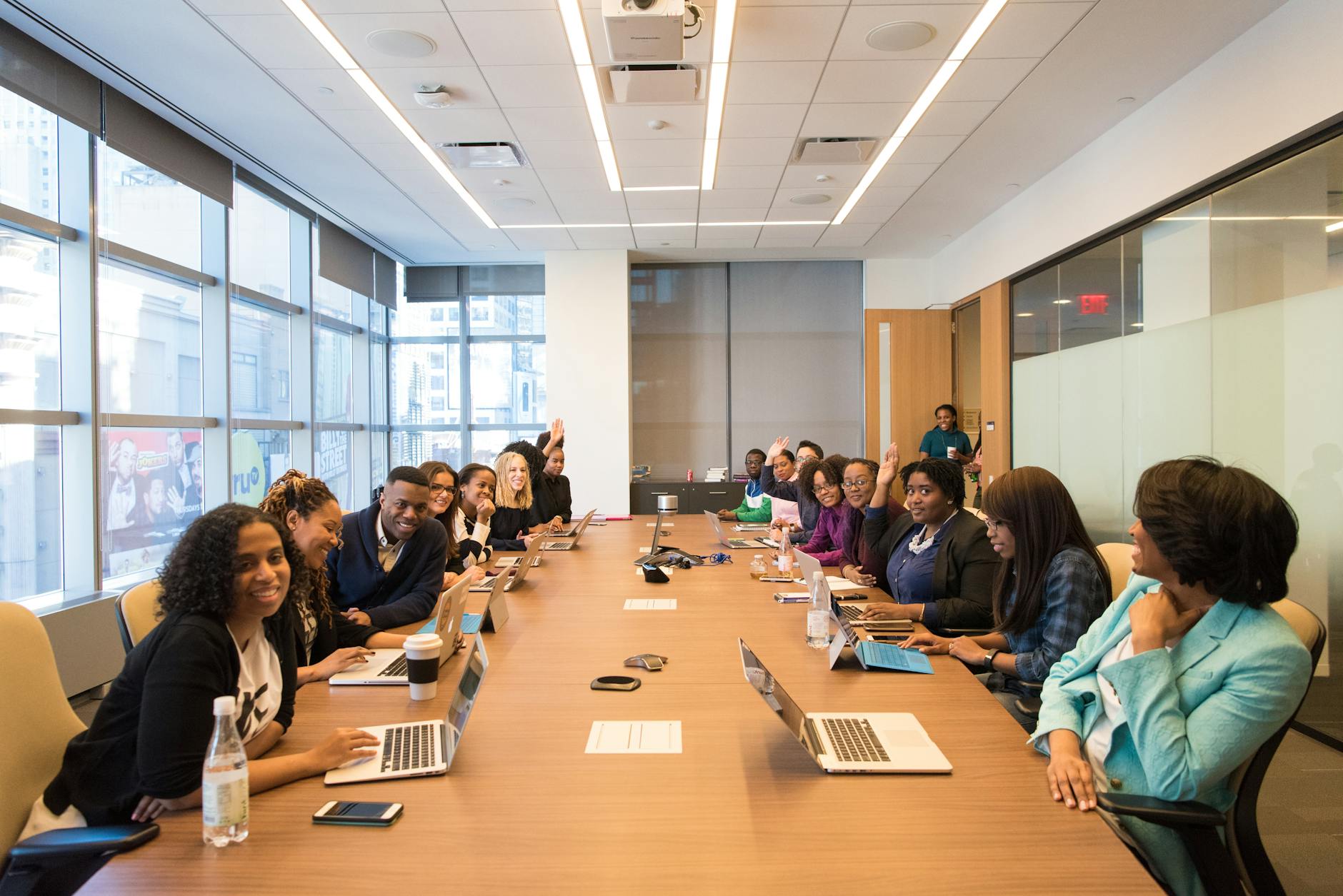 Professional meeting in modern office space with executives discussing strategy