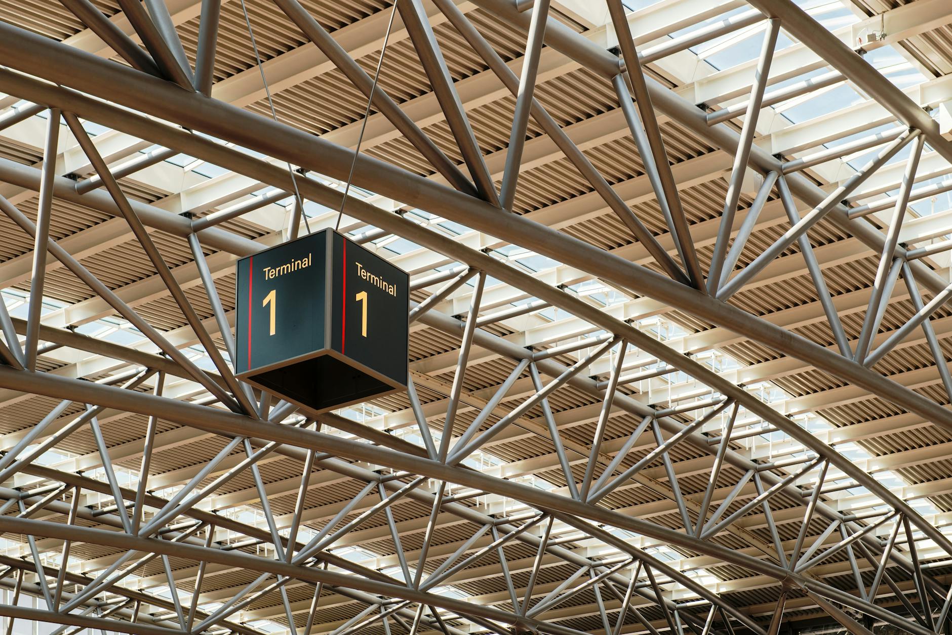 Busy international airport terminal with travelers using electronic devices and WiFi connectivity