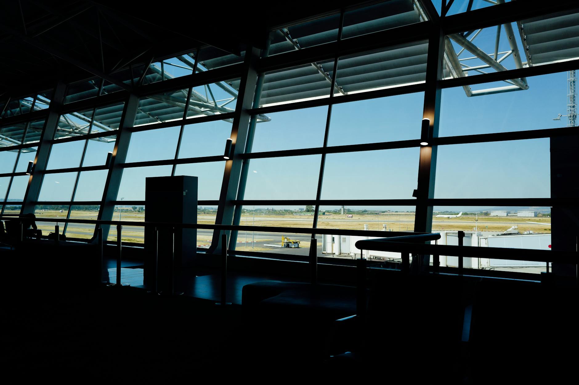 Modern airport lounge interior with comfortable seating and ambient lighting