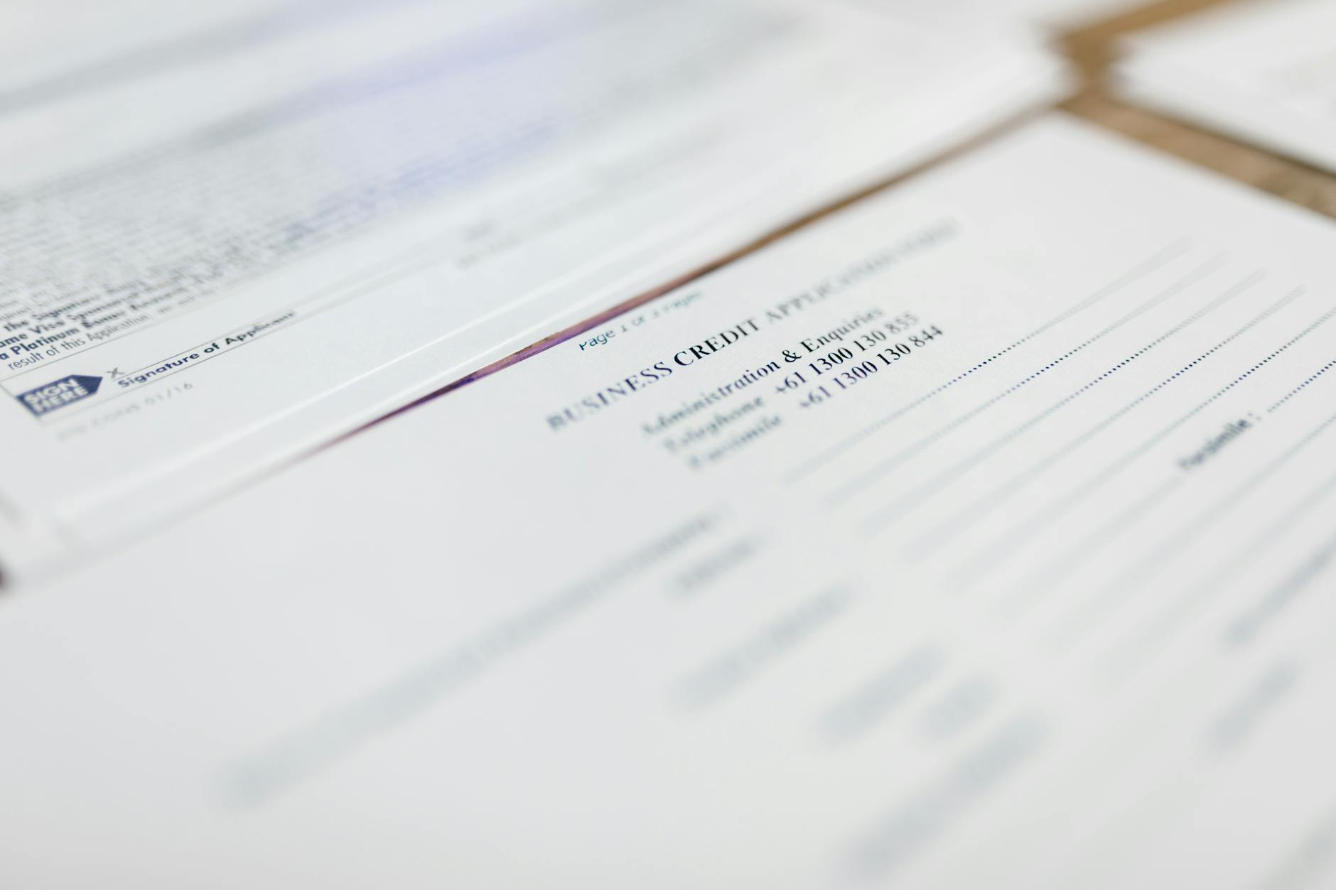 Travel insurance claim forms and documentation spread on desk