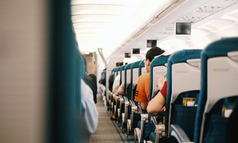 Interior view of commercial airplane cabin with passenger seats