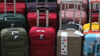 Open suitcase being packed with clothes and travel items organized efficiently