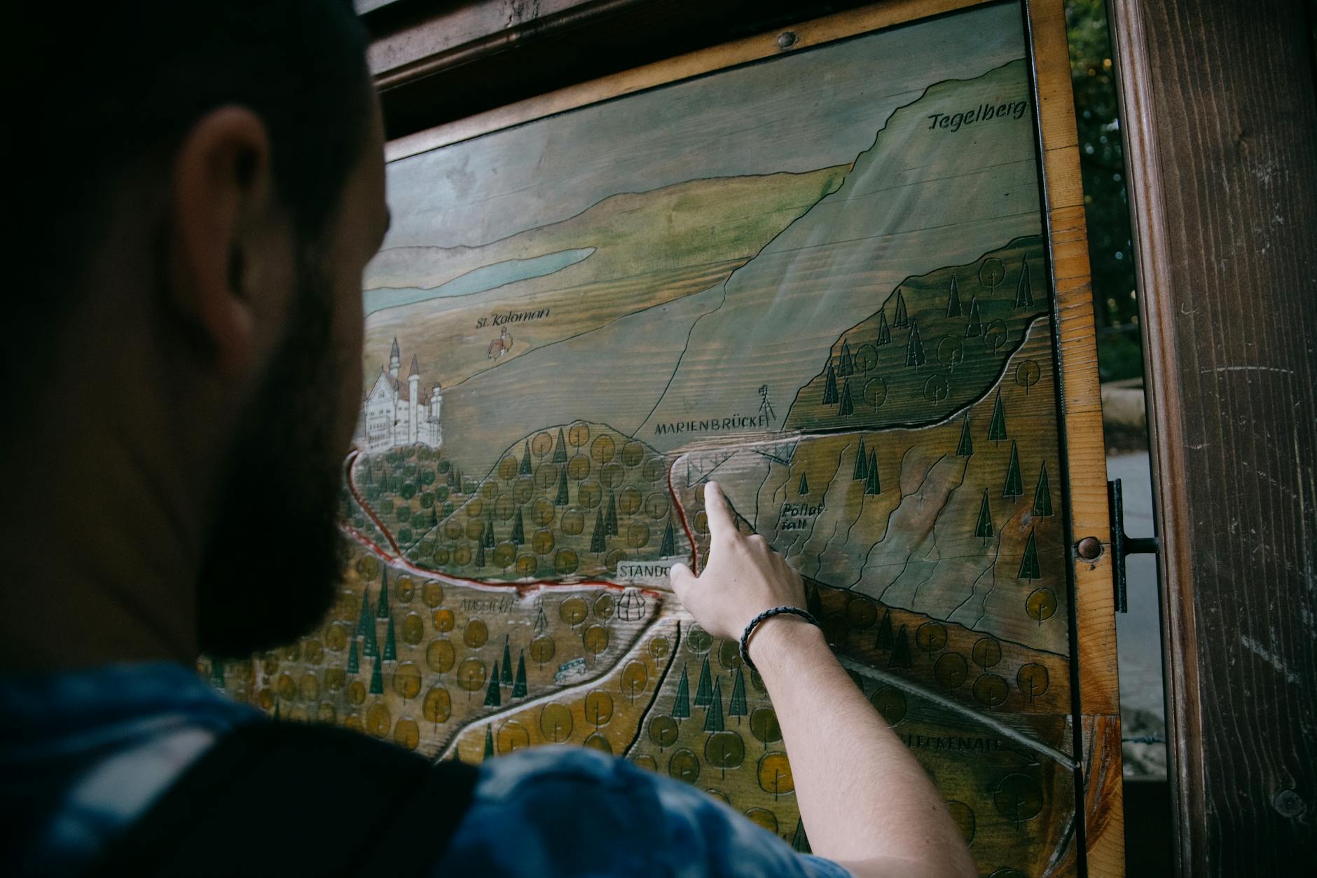 Tourist holding a paper map while exploring a city street