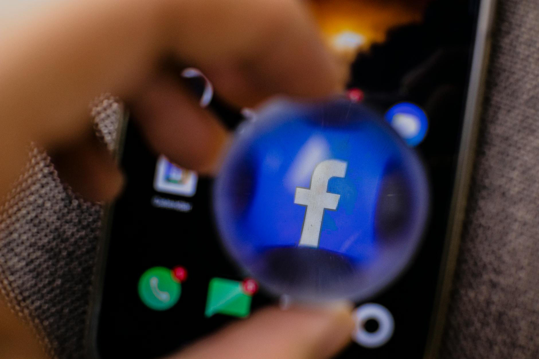 Social media platform icons displayed on mobile device screen showing TikTok and Instagram