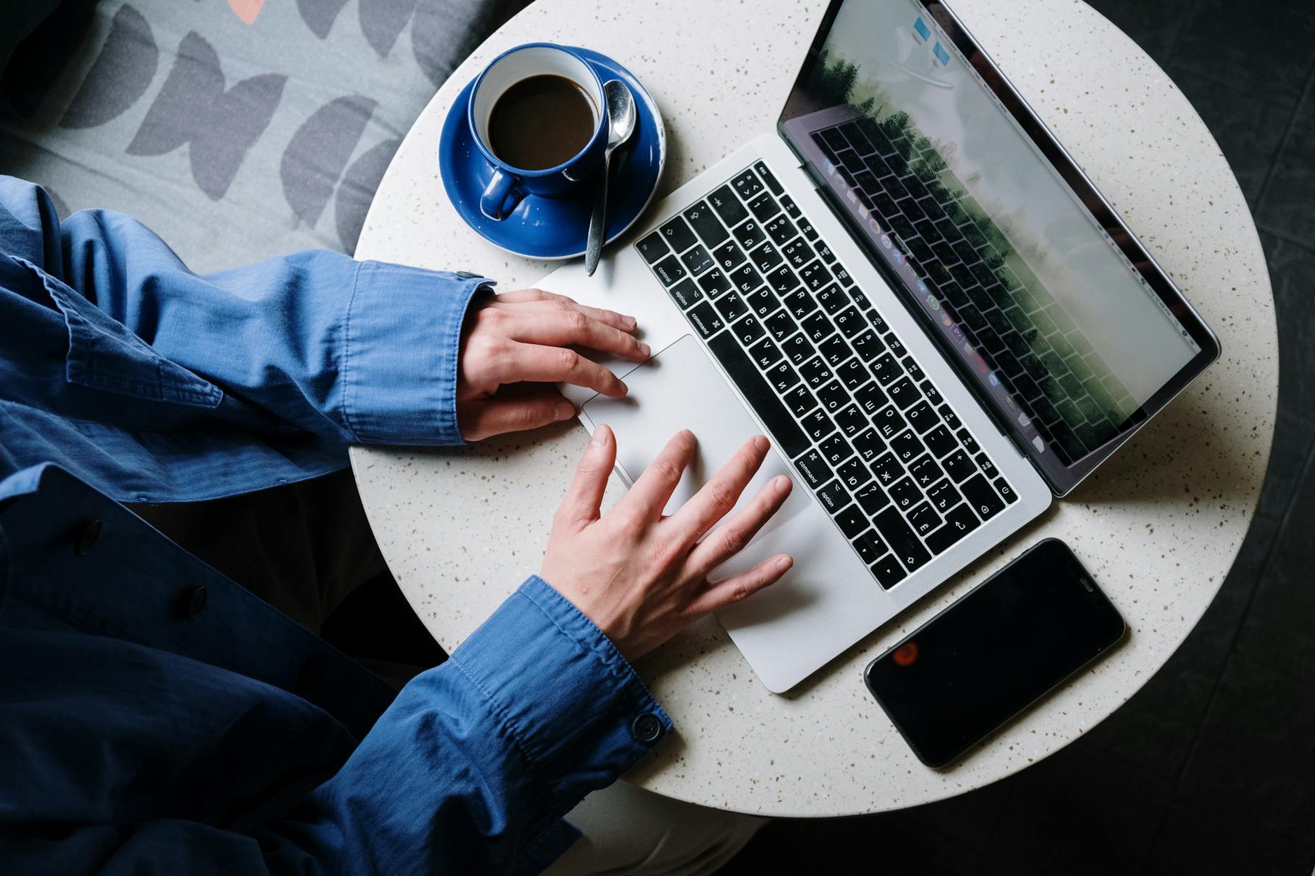Laptop computer connected to wireless internet in coffee shop setting