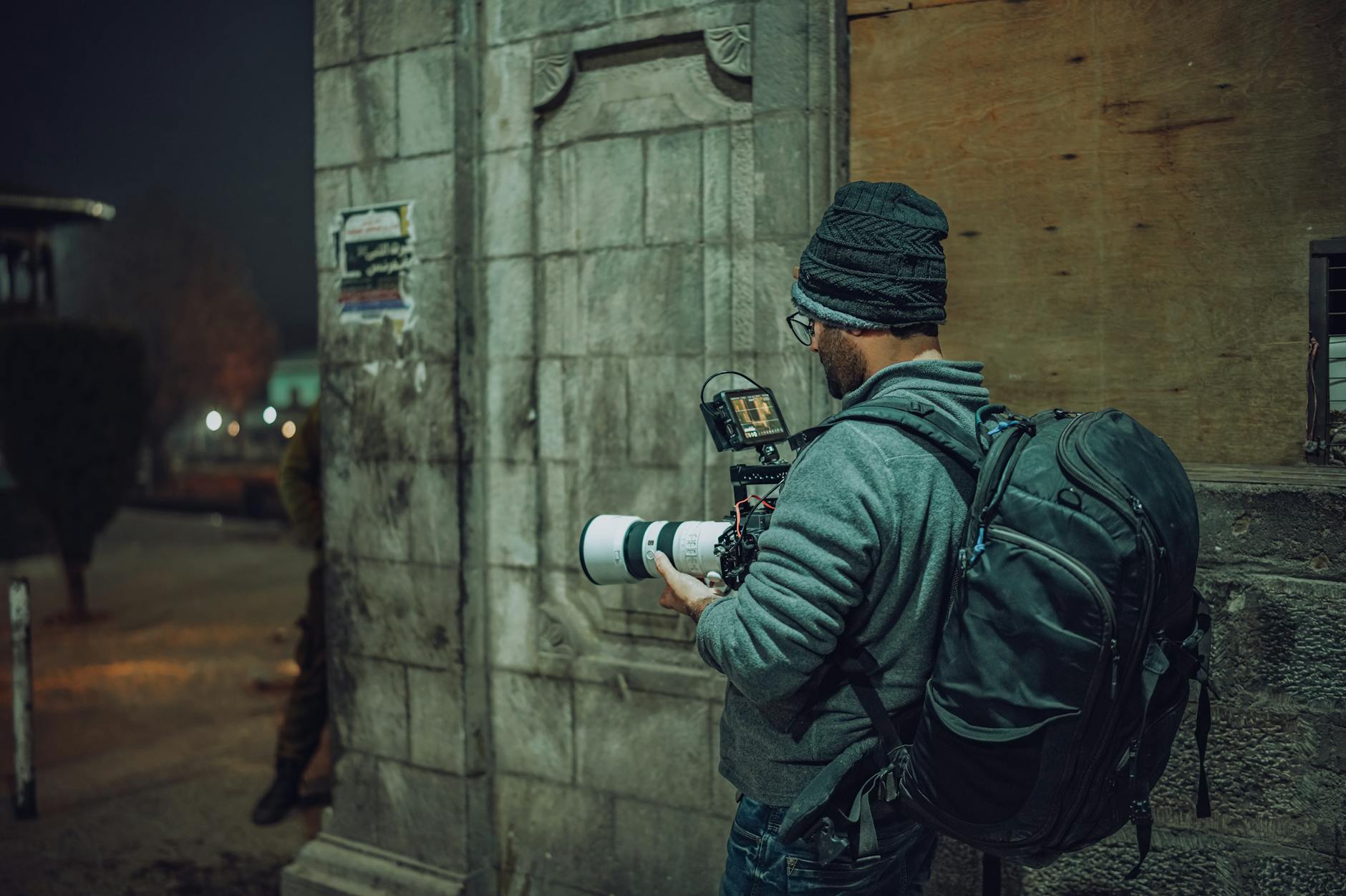 Professional photography equipment including camera and lighting setup in low light conditions  