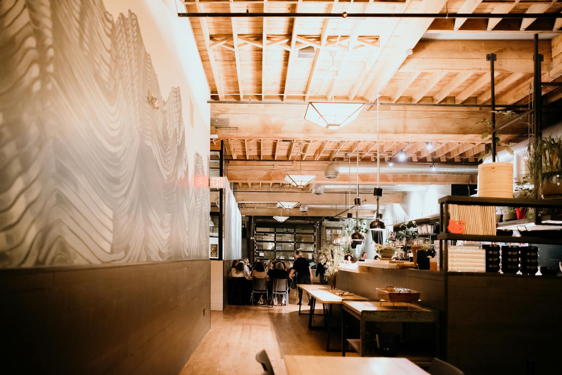 Traditional restaurant interior with wooden tables and cultural decorations