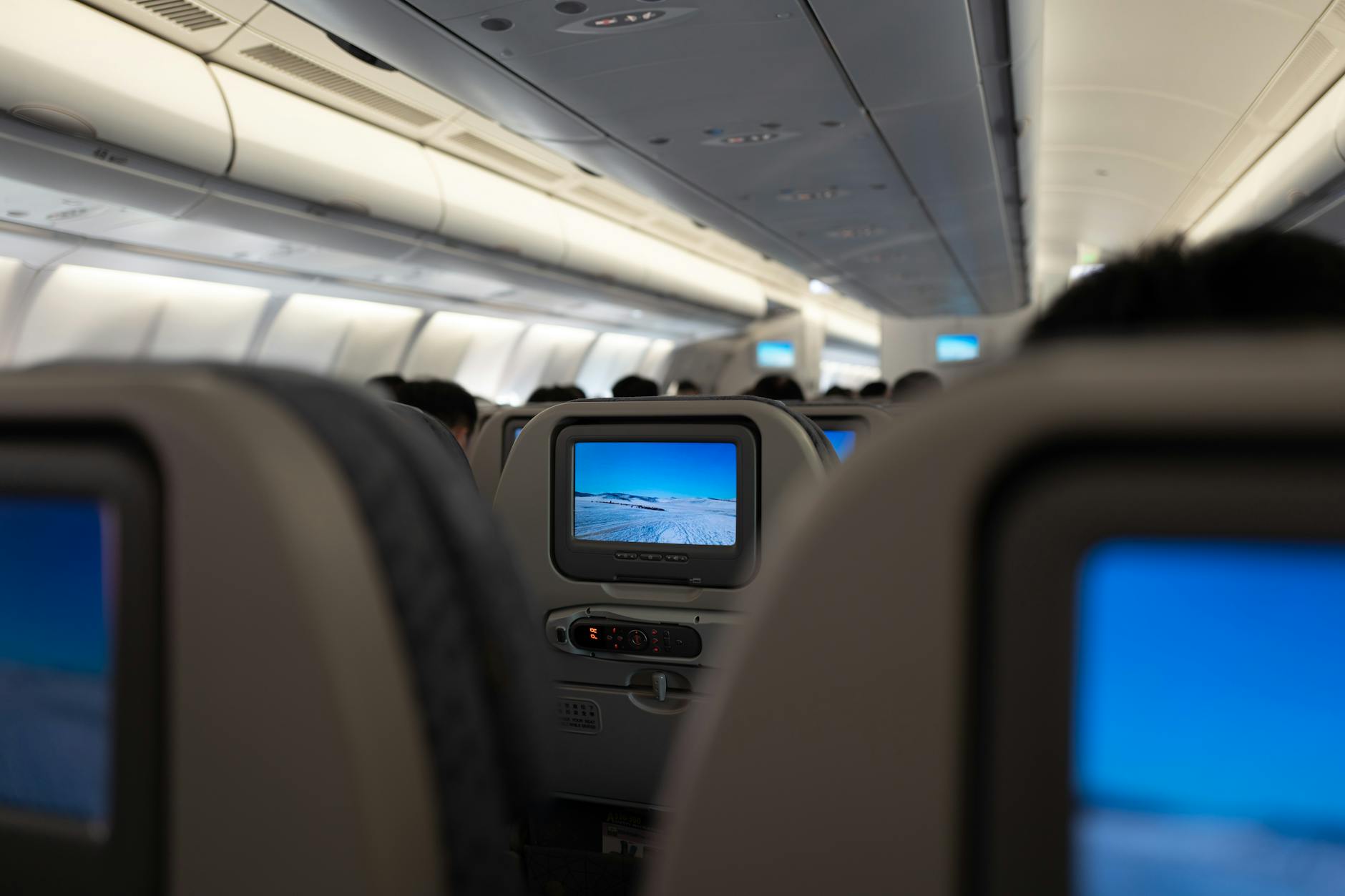 Business class airplane cabin with premium seats and amenities