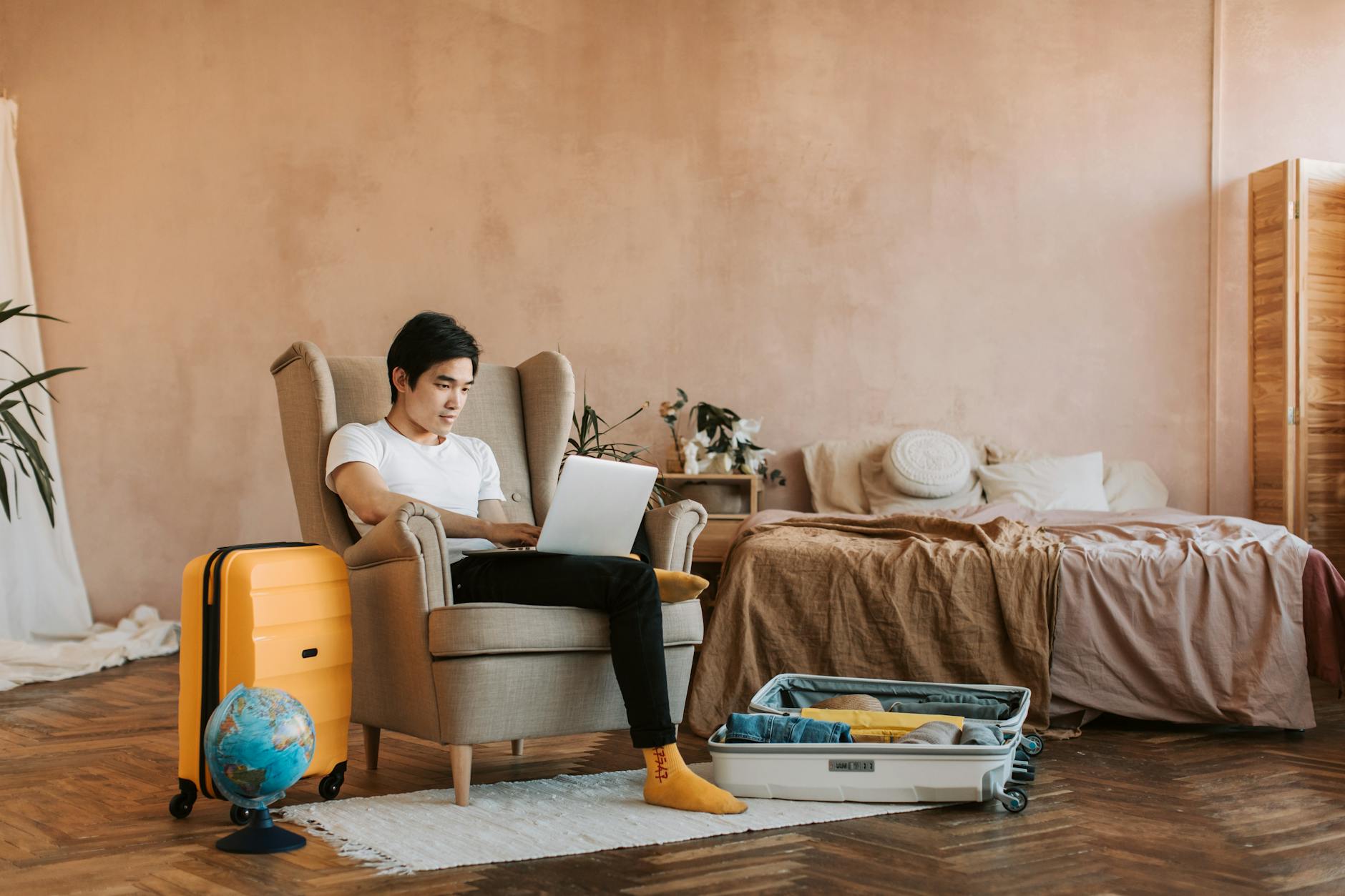 Person working on laptop in comfortable shared living space