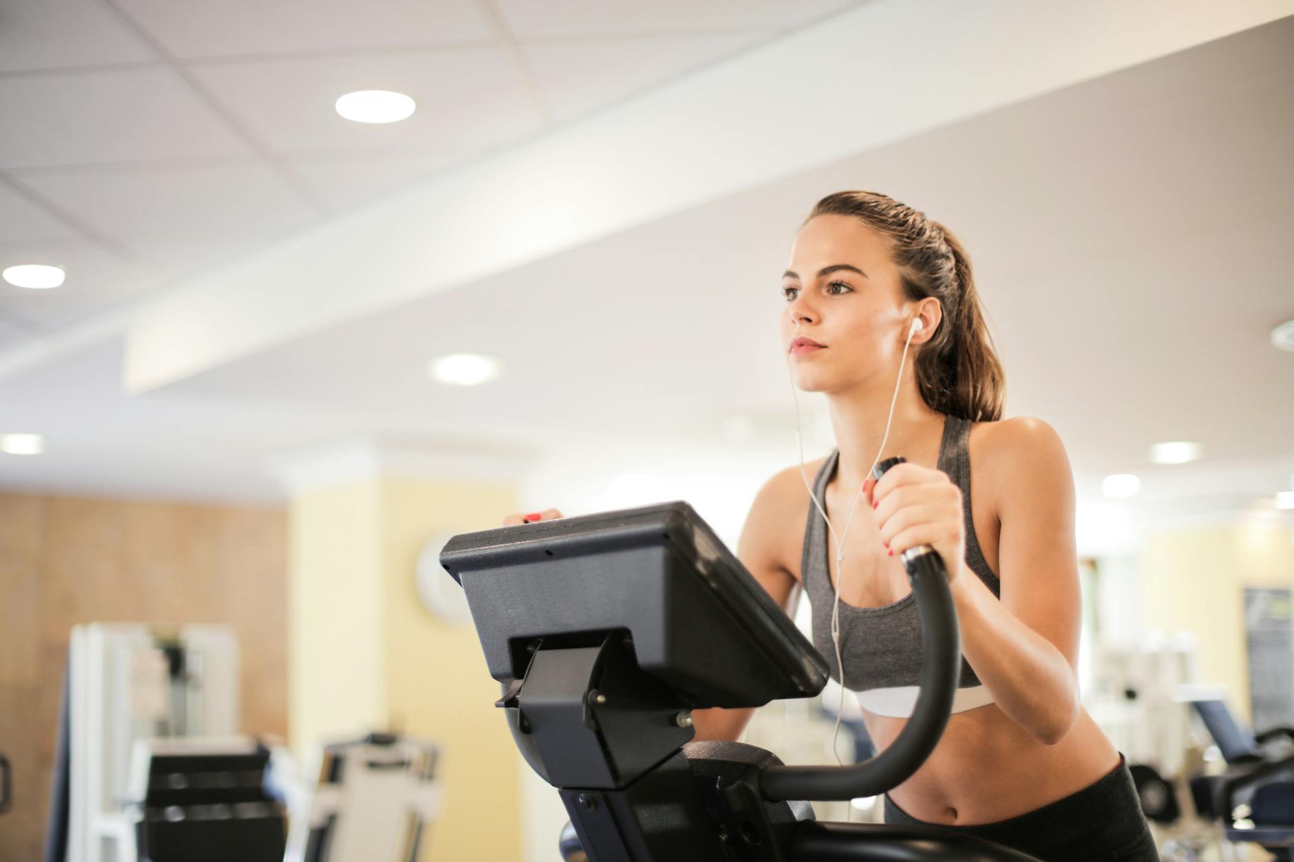 Modern hotel fitness center with cardio equipment and weights