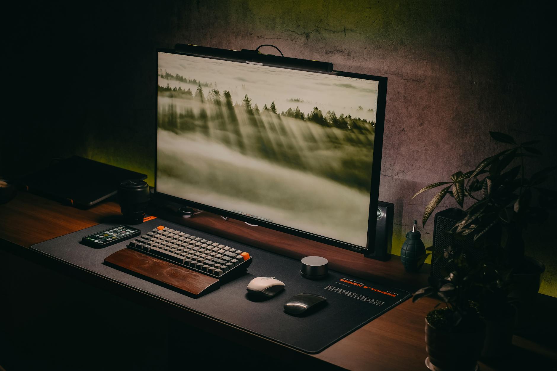 Modern home office setup with computer and video conferencing equipment