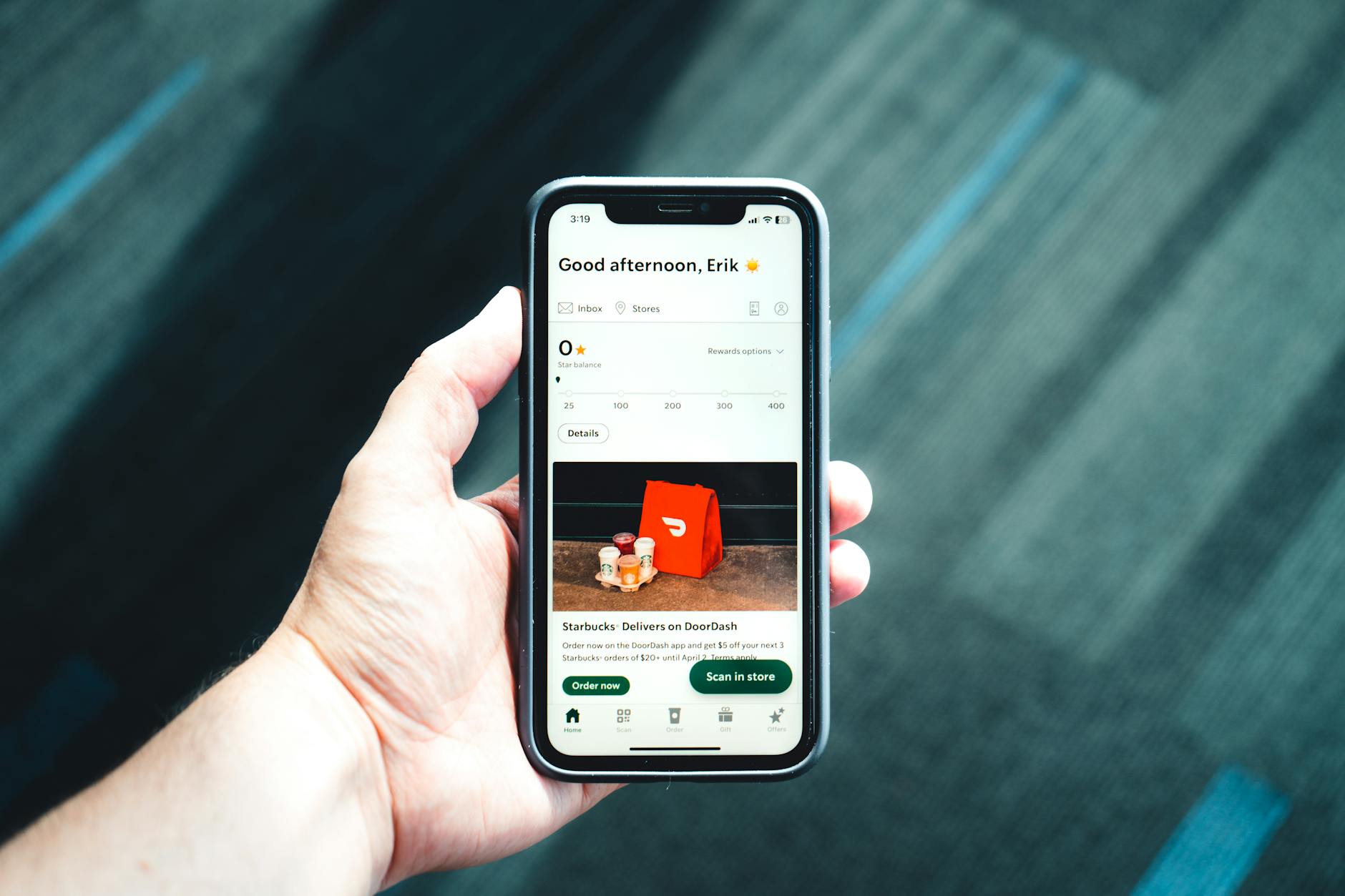 Person using smartphone app to manage travel loyalty program points and rewards