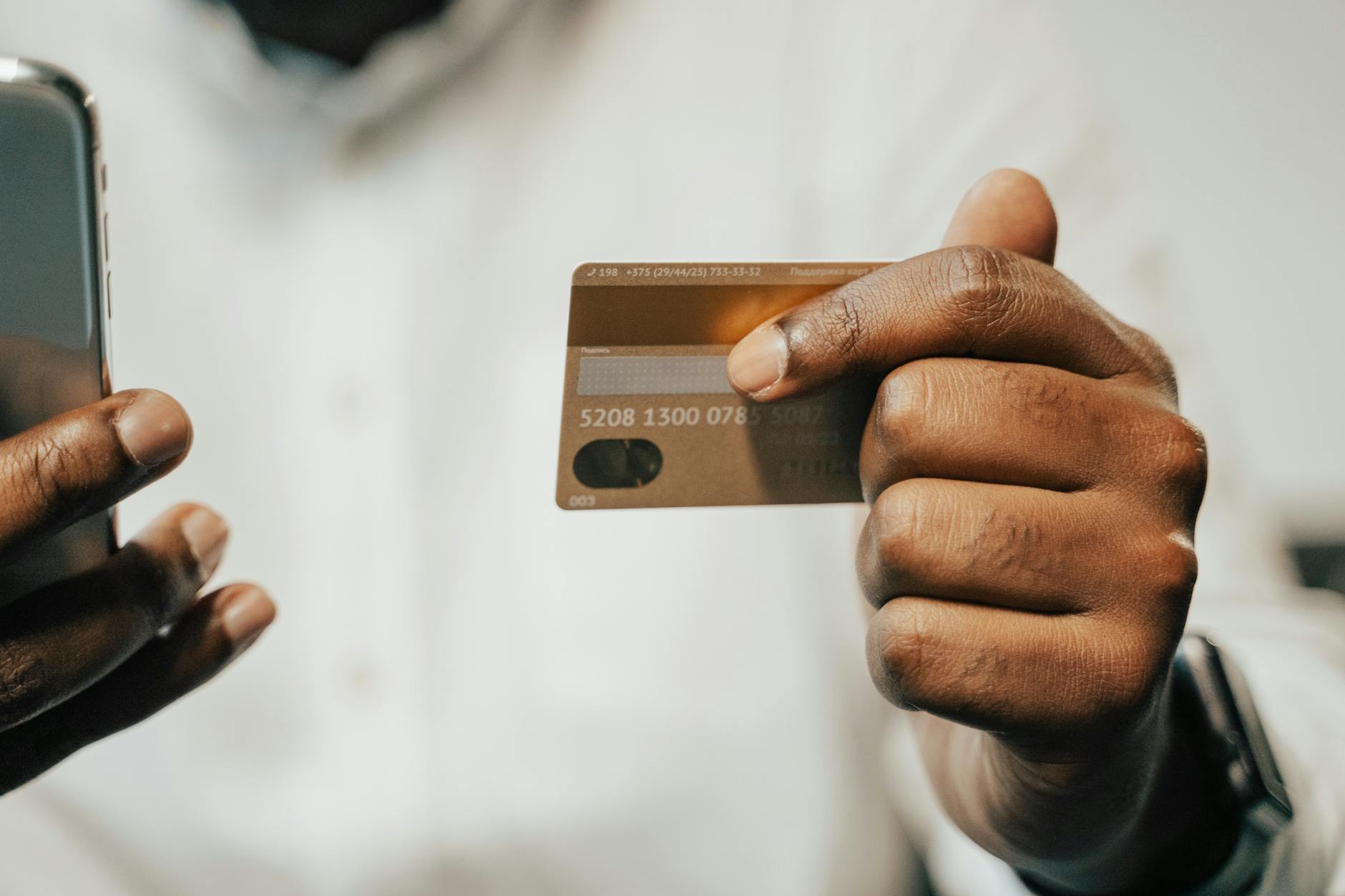 Smartphone displaying currency exchange app with real-time rates