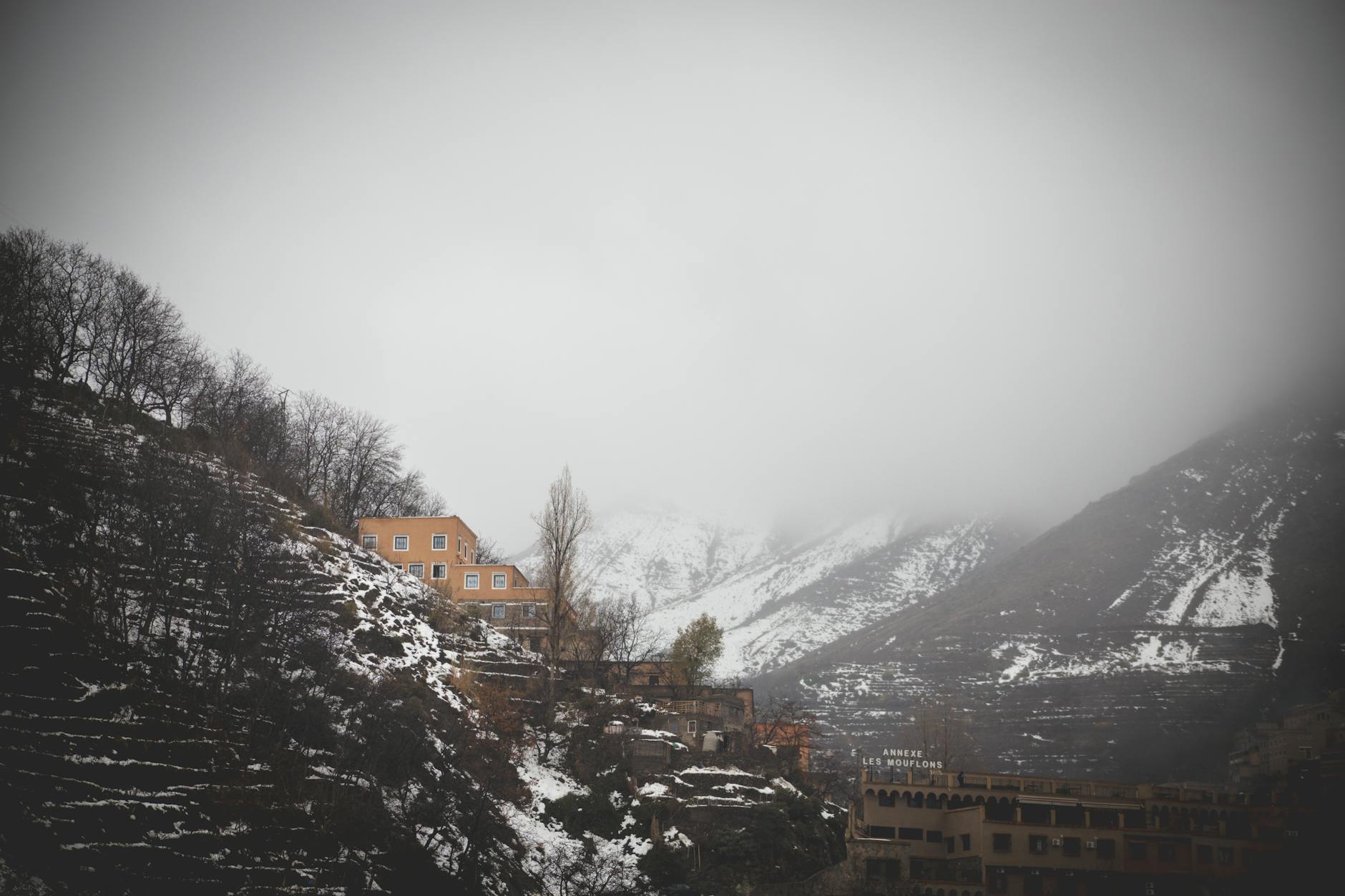 Dramatic peaks and valleys of Morocco's High Atlas Mountains with snow-capped summits