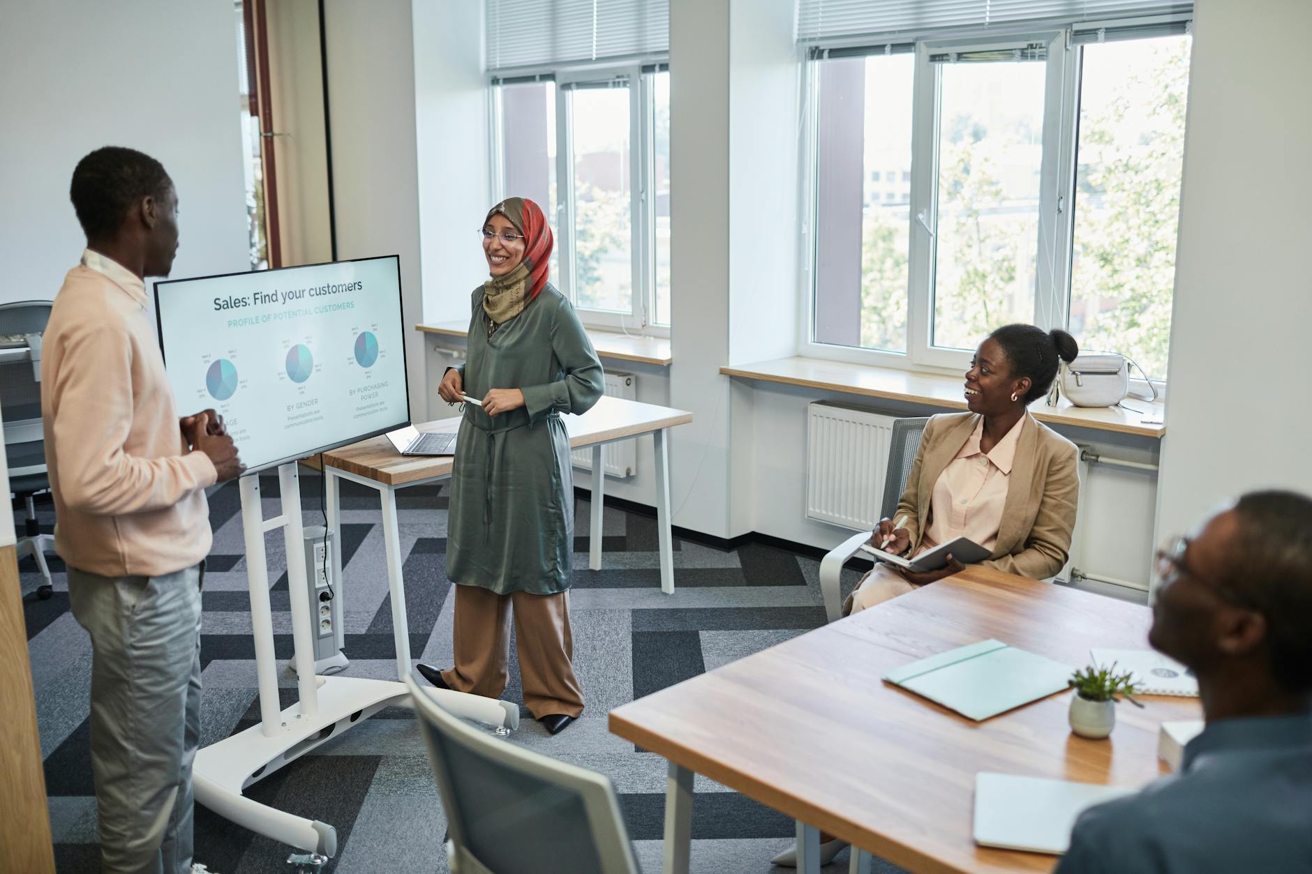 Professional giving business presentation to audience in corporate setting