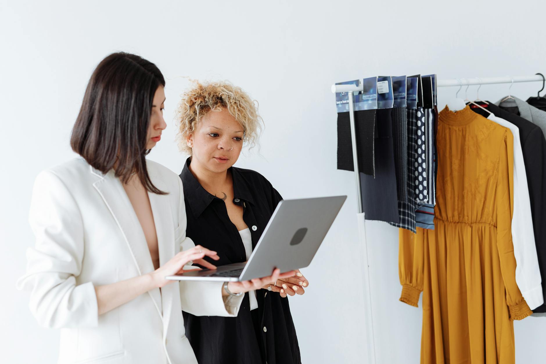 Professional stylist organizing clothing and accessories for client consultation