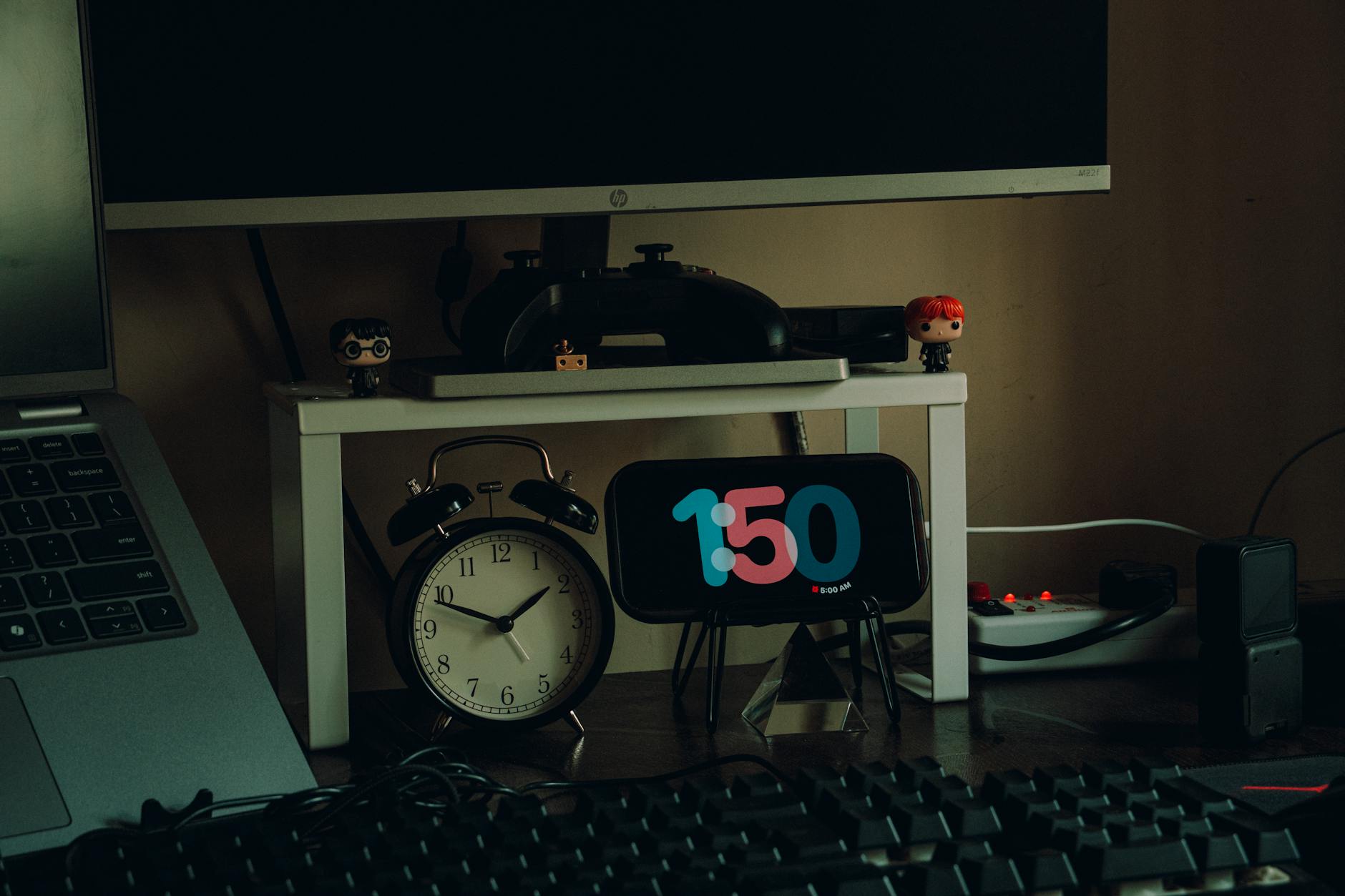 Clean, organized home workspace with laptop, monitor, and professional accessories