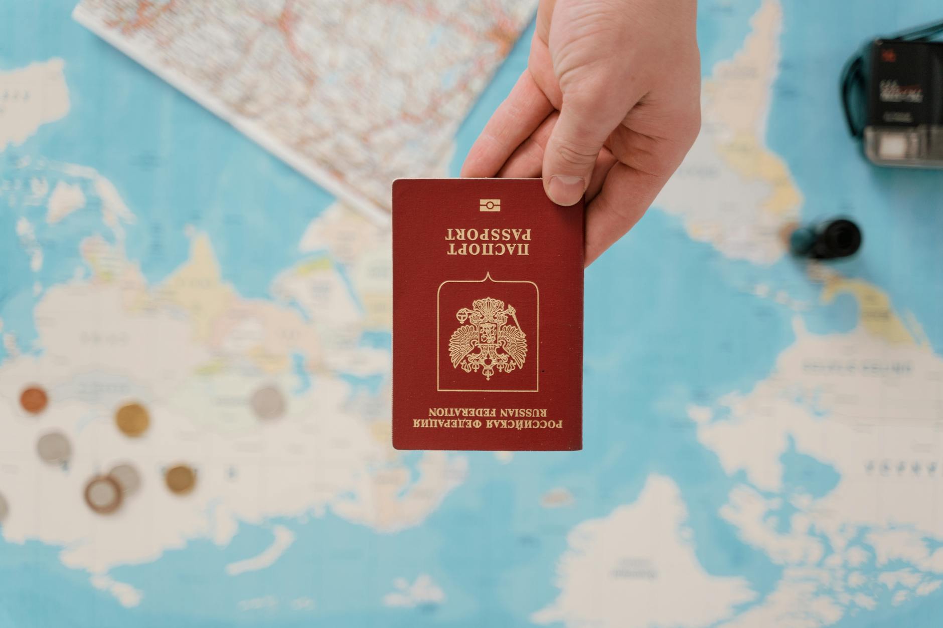 Passport and official documents spread on desk for visa application