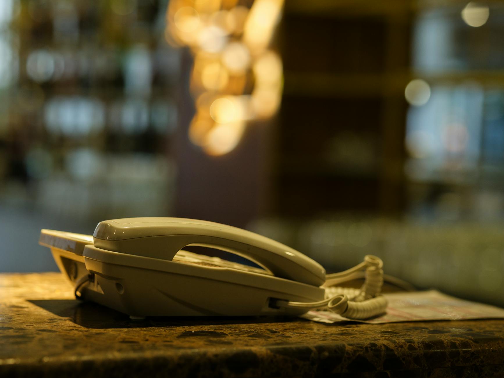 Smartphone turned off and placed on wooden desk surface