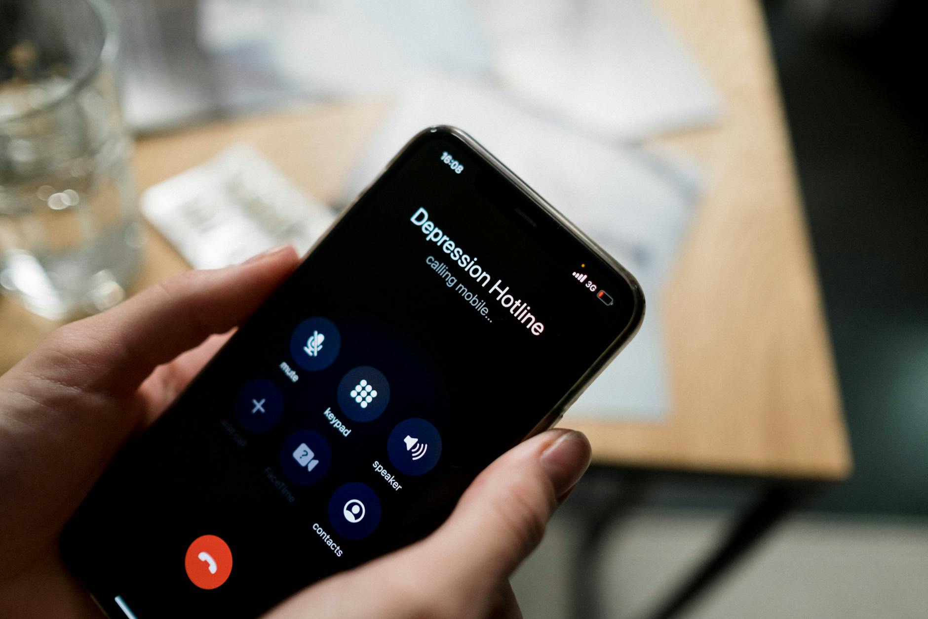 Person making phone call to insurance company for claim follow-up