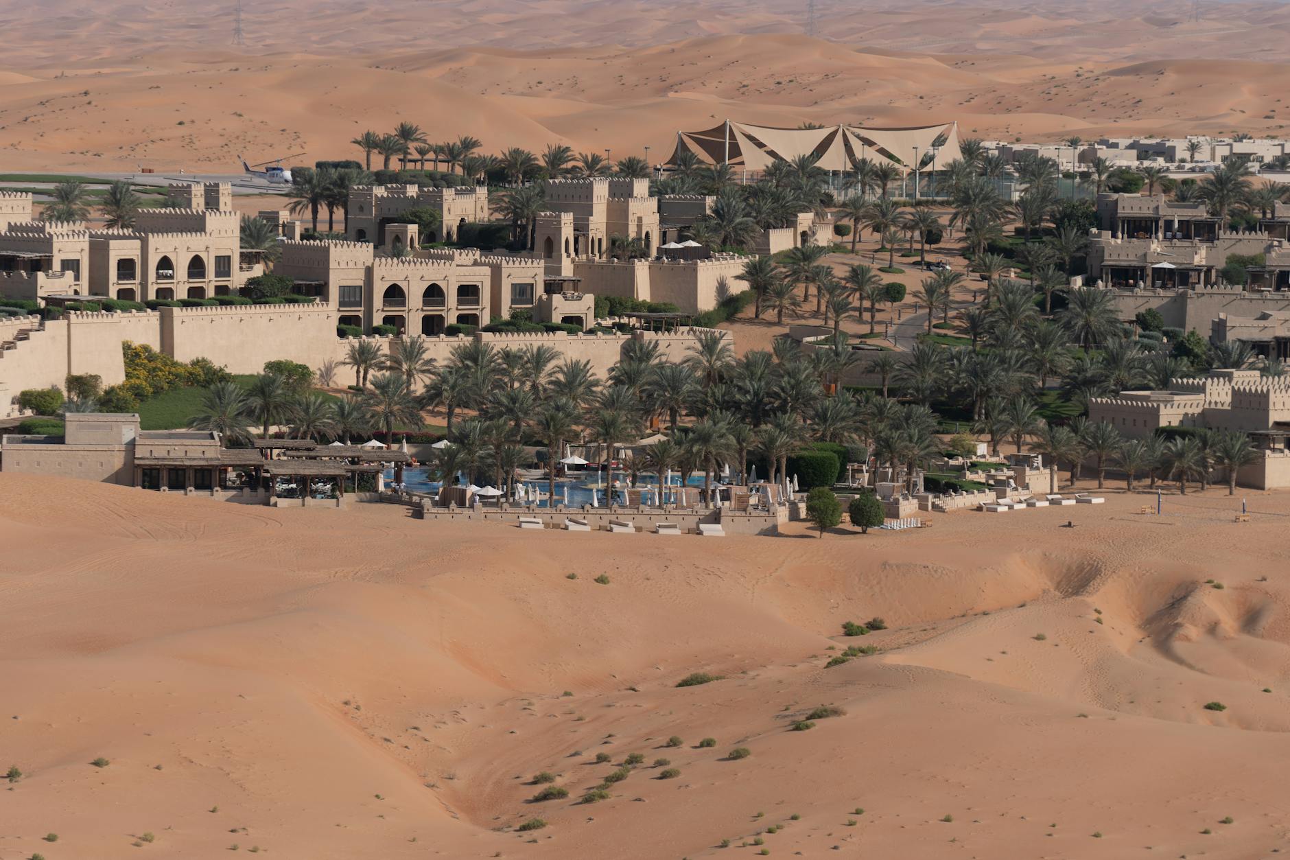 Modern hotel building with large windows designed for stargazing in desert environment