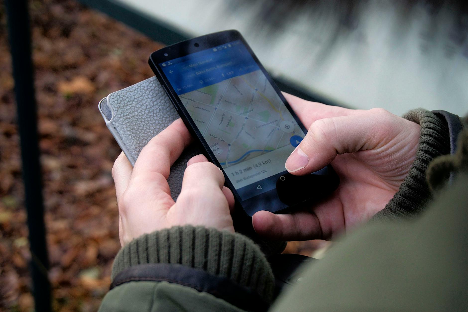 Hand holding smartphone displaying travel app interface for mobile check-in services