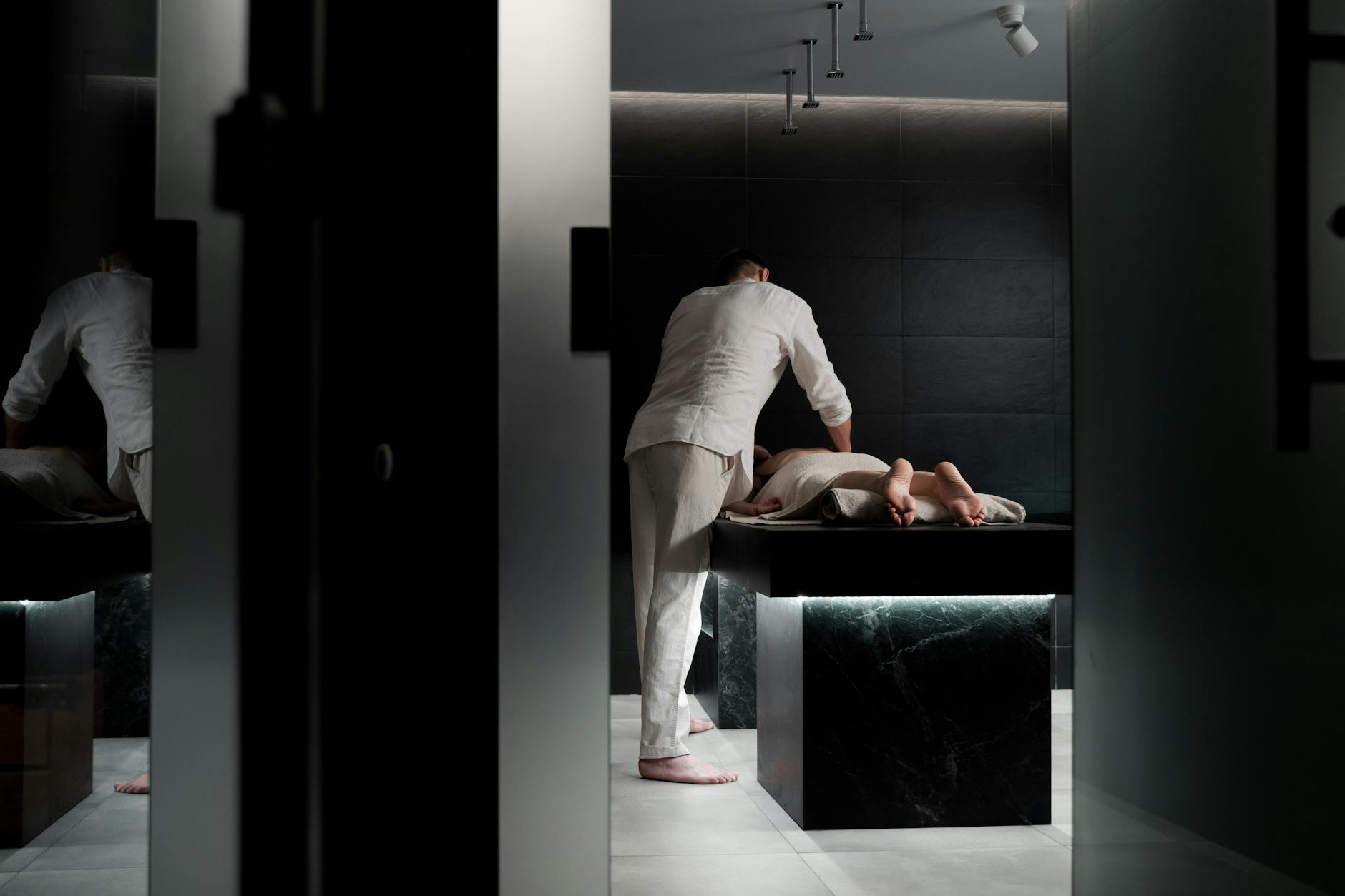 Luxurious spa treatment room with massage table and wellness amenities