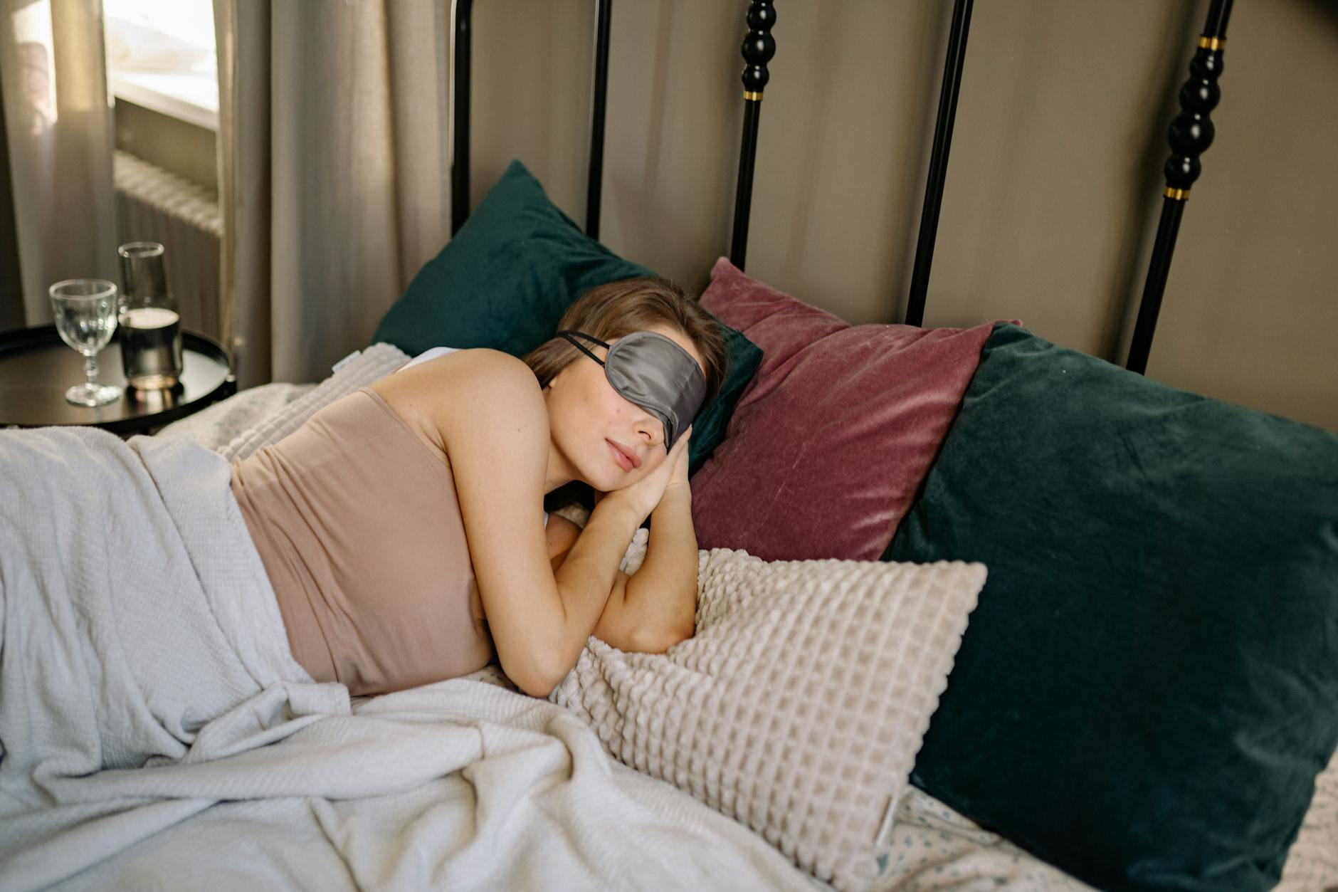 Modern capsule sleeping pod with ambient lighting and comfortable bedding
