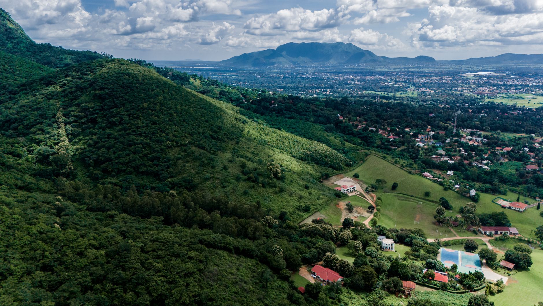 Misty highland village in the Usambara Mountains of Tanzania surrounded by green hills