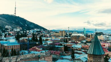 Aerial view of Tbilisi old town with traditional balconied buildings and sulfur bath domes
