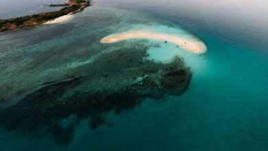 Aerial view of a remote tropical archipelago with turquoise water and coral reefs
