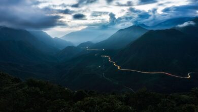 Winding mountain road through limestone karst landscape in northern Vietnam