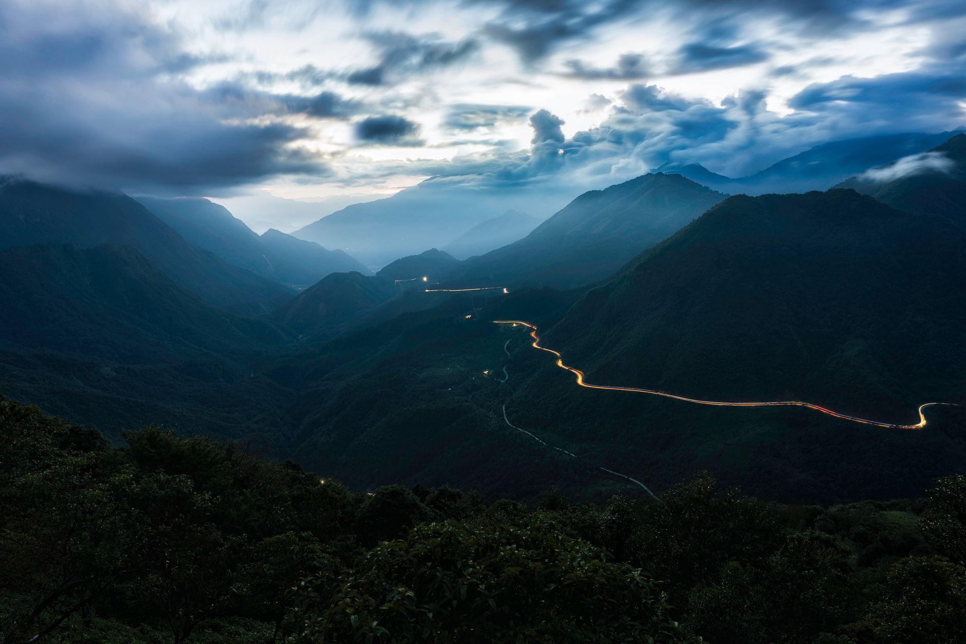 Winding mountain road through limestone karst landscape in northern Vietnam