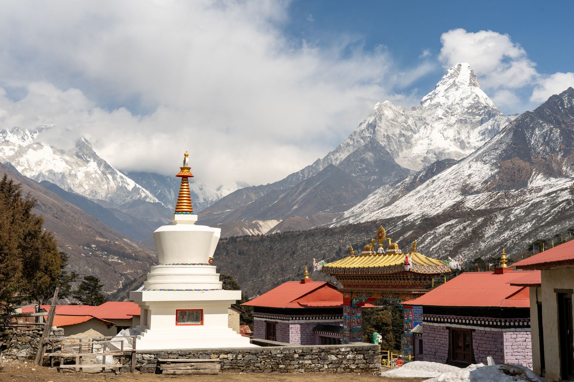 An ancient Buddhist monastery perched on a rocky cliff in the Himalayas