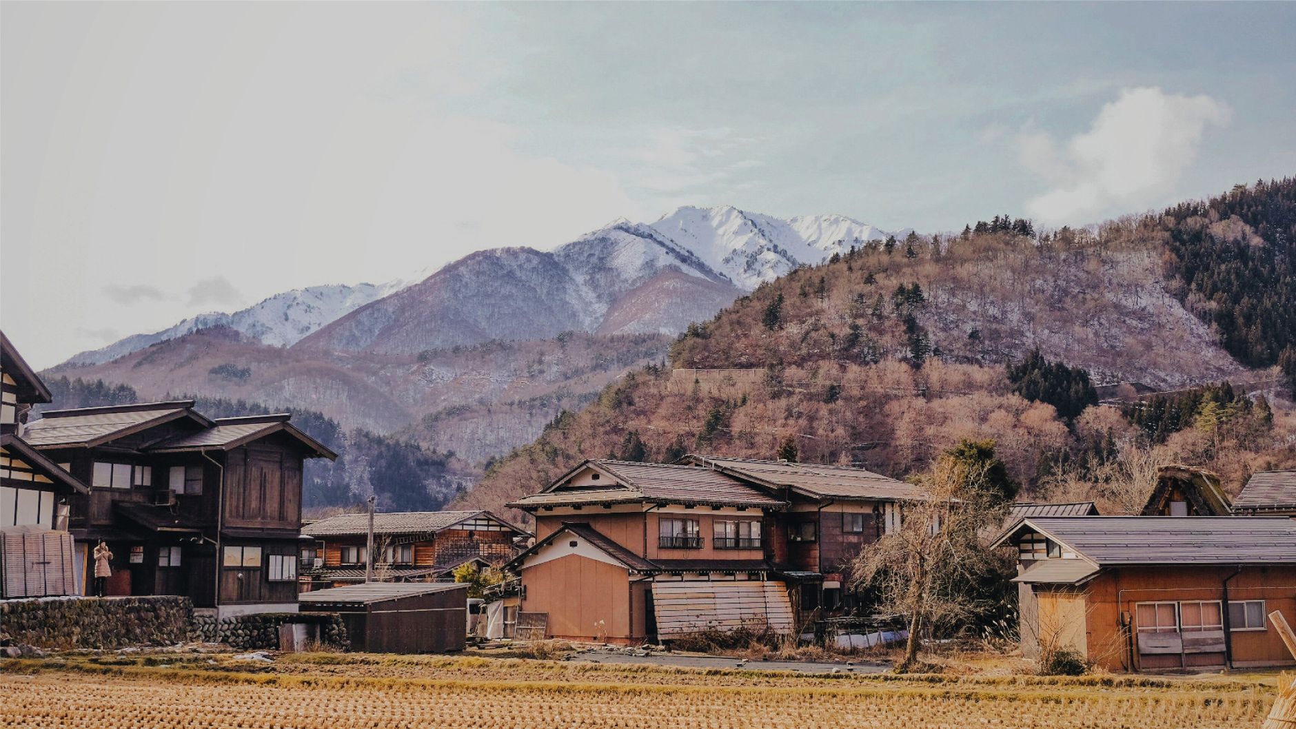 Small traditional village settlement surrounded by high mountain landscape in Central Asia