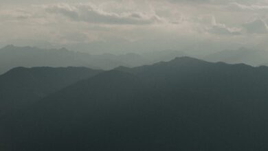 Mist rolling over a green mountain range in Sri Lanka's Knuckles highlands