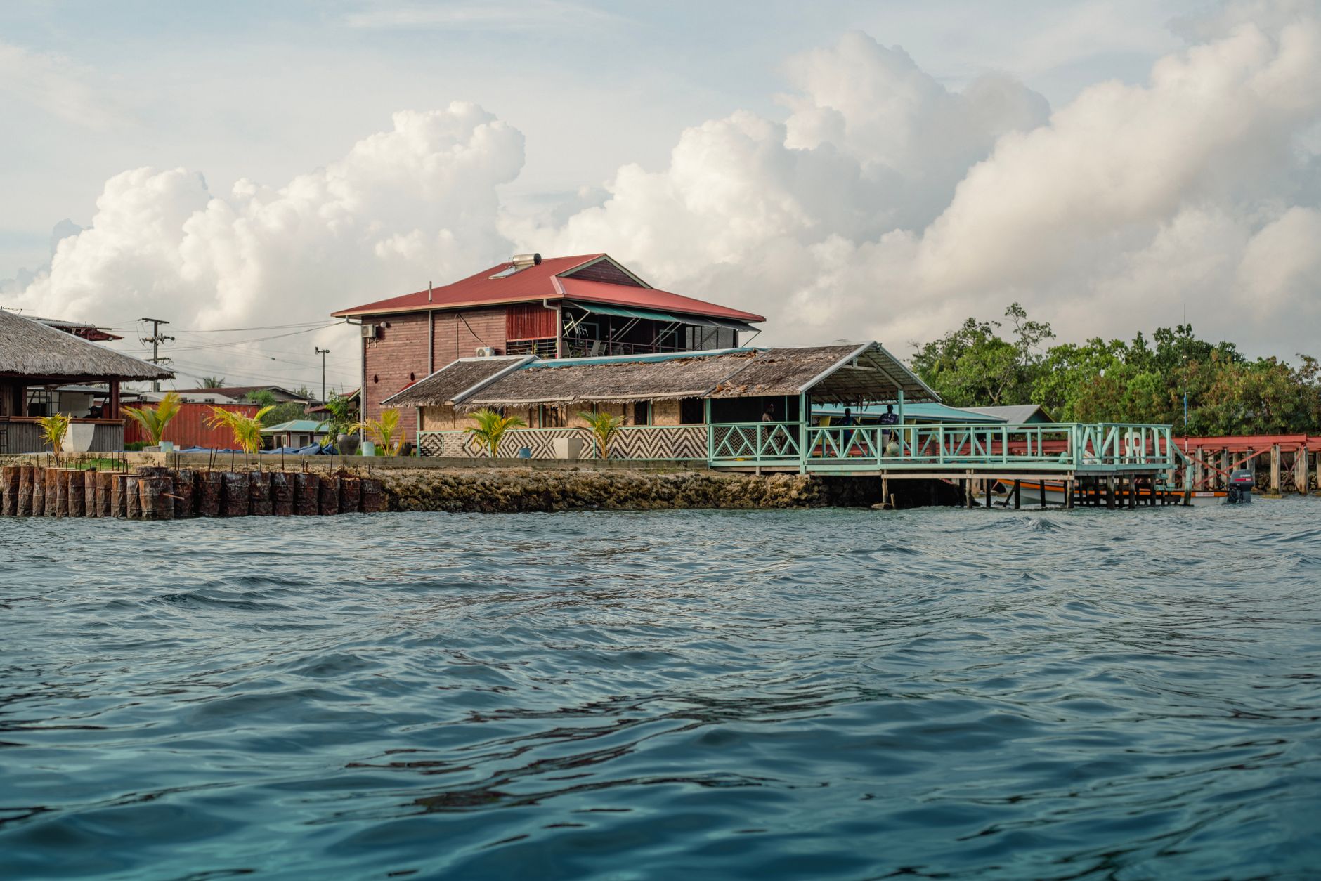 Small eco-lodge situated between forest and ocean coastline in a remote tropical setting
