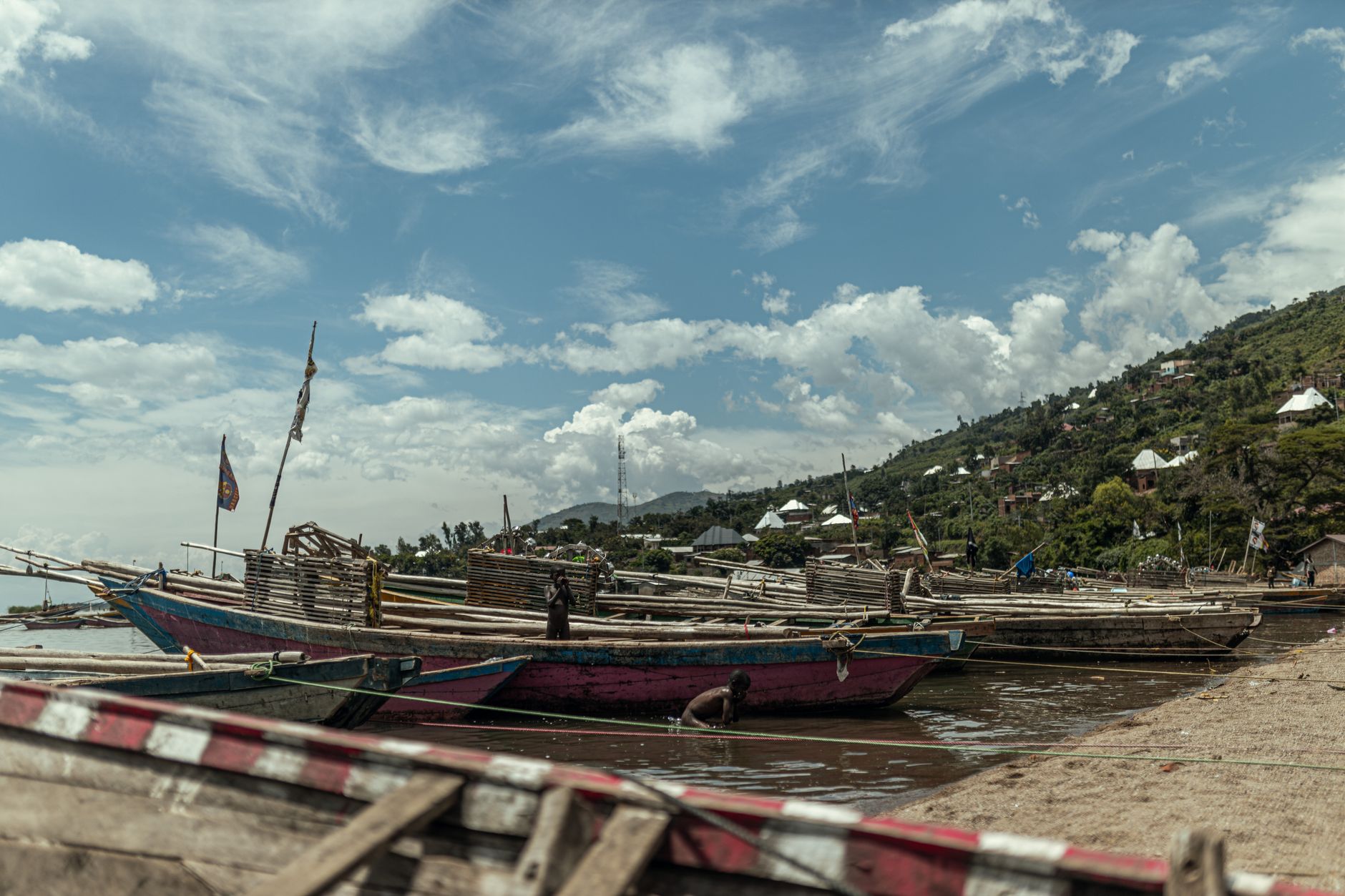 Traditional coastal village with coral-stone buildings along an East African island shoreline