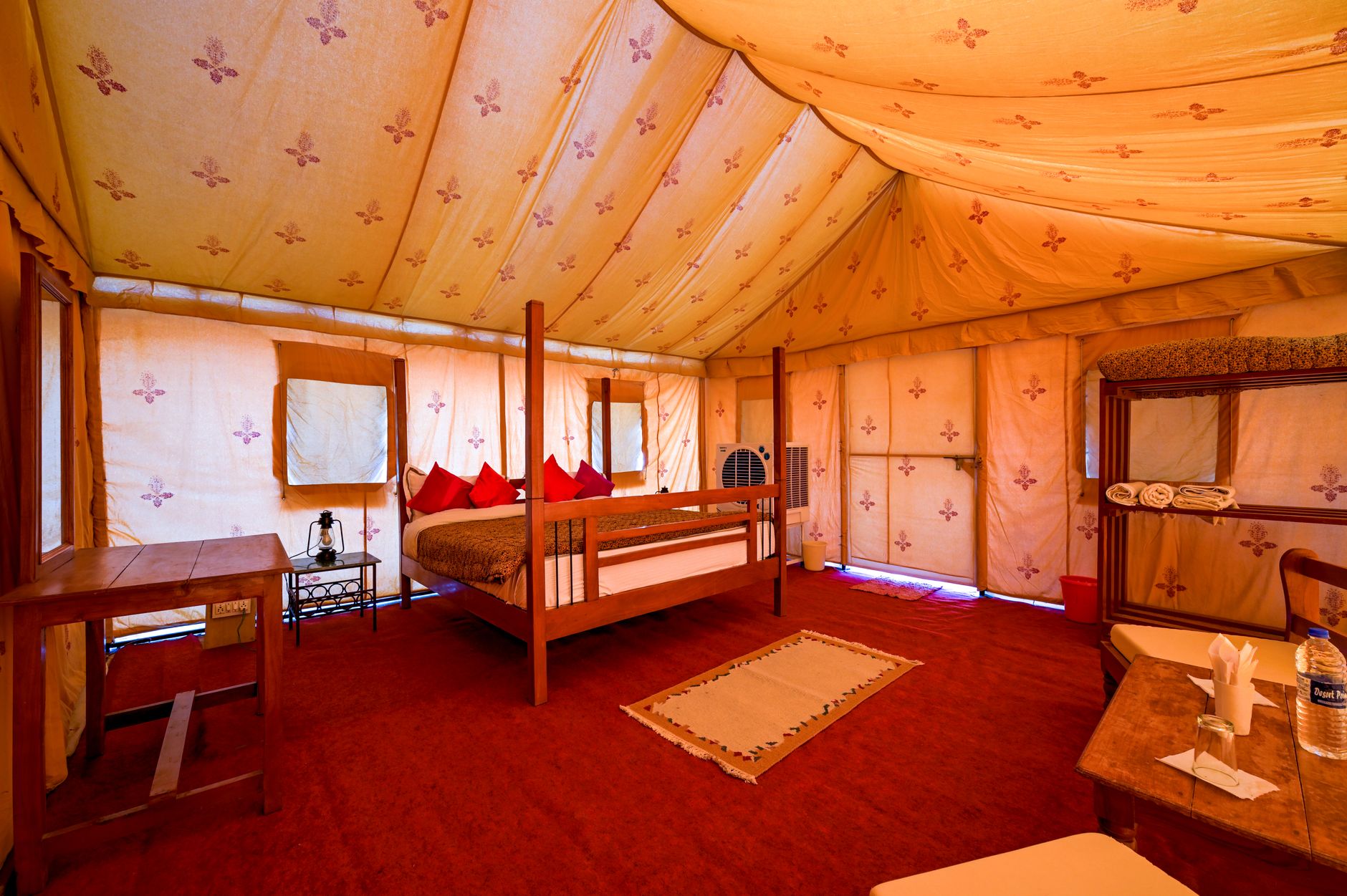 Luxury tented safari camp positioned along a riverbank in East Africa